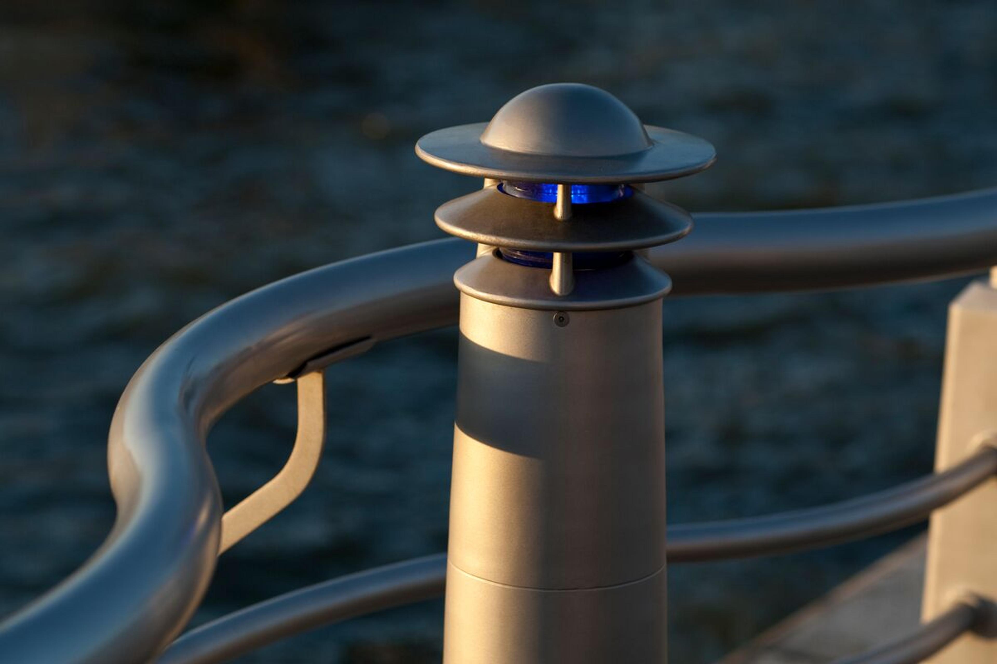 Custom lighting with a nautical theme • Designed to coordinate with 7 miles of railing start to finish • Stainless steel to weather life on the Hudson River