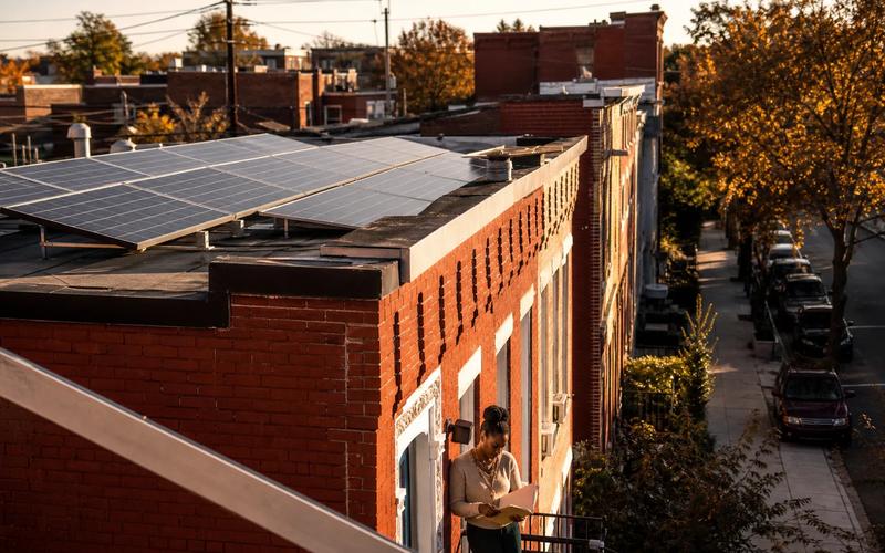 Washington DC rowhouse block with rooftop solar panels, illustrating how to compare the best solar companies in DC