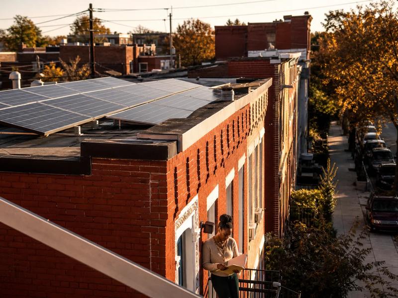 Washington DC rowhouse block with rooftop solar panels, illustrating how to compare the best solar companies in DC