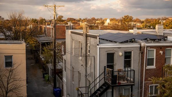 Washington DC rowhouse rooftops with solar panels, tied to DC SRECs value in 2026