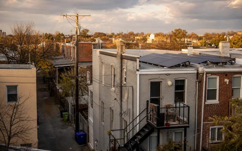 Washington DC rowhouse rooftops with solar panels, tied to DC SRECs value in 2026