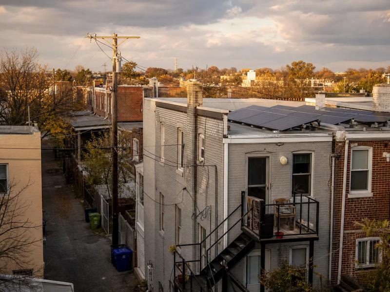 Washington DC rowhouse rooftops with solar panels, tied to DC SRECs value in 2026