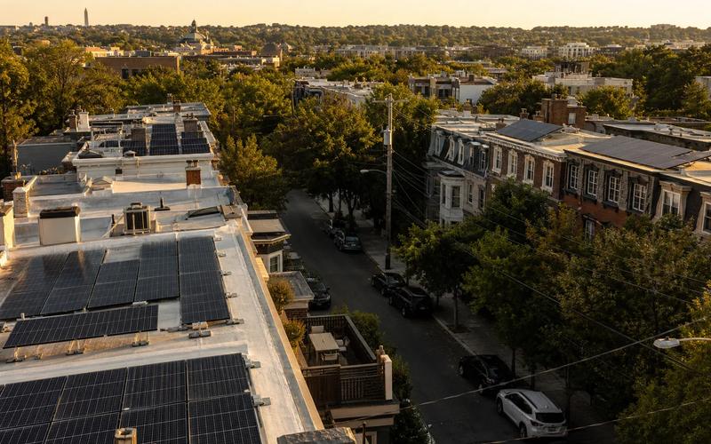 Rowhouse rooftops in Washington, DC with solar panels—Tesla solar roof alternative in 2026