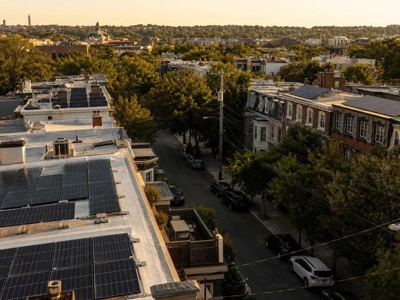 Rowhouse rooftops in Washington, DC with solar panels—Tesla solar roof alternative in 2026