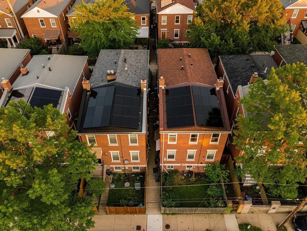 Aerial view of Petworth DC row houses with solar panels installed on rear roof slopes