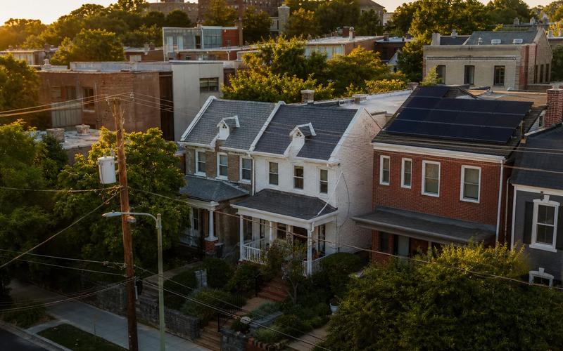 Washington, DC gable roofs with solar panels in view; guide to Tesla Roof solar shingles alternatives in 2026