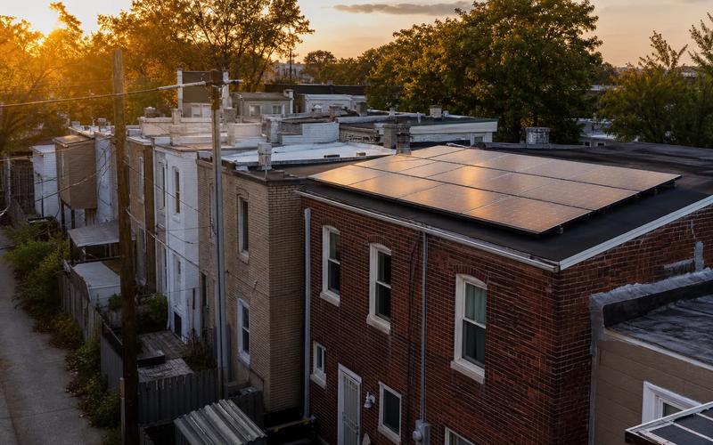 Washington DC rowhouse rooftops with solar panels, discussing cost of solar panels in Washington DC in 2026