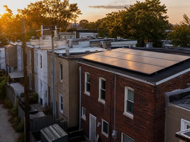 Washington DC rowhouse rooftops with solar panels, discussing cost of solar panels in Washington DC in 2026