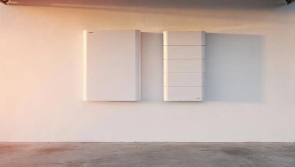 Tesla Powerwall 3 and Enphase IQ Battery 5P mounted side by side in a DC home utility room