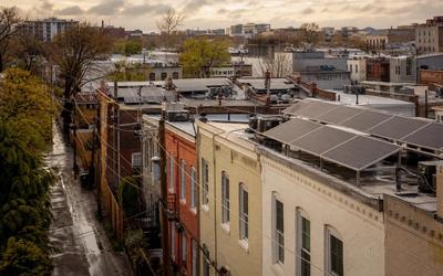 Washington DC rooftop solar on a cloudy day, showing panels generating despite overcast conditions
