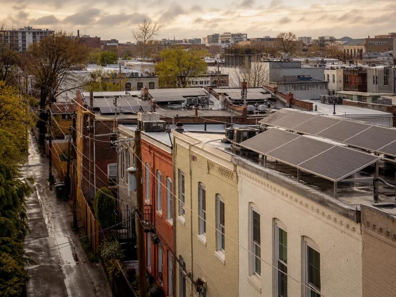 Washington DC rooftop solar on a cloudy day, showing panels generating despite overcast conditions