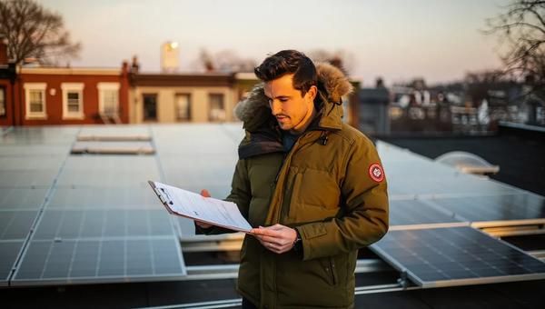 Solar panels on a DC rowhouse roof with a financing comparison overlay showing cash, loan, and PPA options