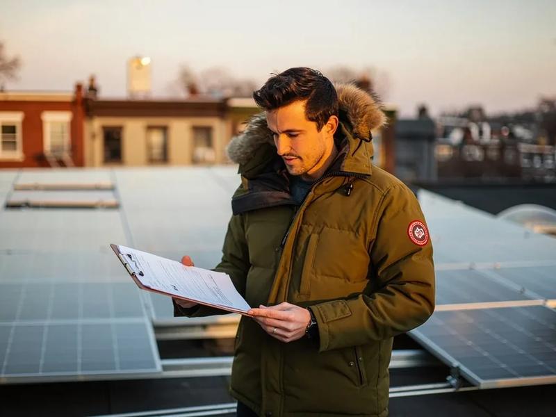 Solar panels on a DC rowhouse roof with a financing comparison overlay showing cash, loan, and PPA options