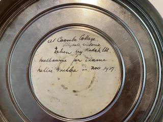 Film can with inscription that reads: at Coombe Cottage Lilydale Victoria. Taken by Kodak Ltd Melbourne for Dame Nellie Melba in Nov. 1927. 