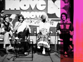 Four people sitting in a tv studio