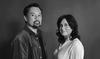 Artists Melvin J. Montalban and Leila Jeffreys stand facing each other with their heads turned towards the camera