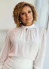 Upper body shot of NFSA board member, journalist Karina Carvalho.