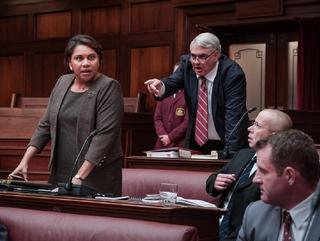 Dramatic scene with a man pointing aggressively at an indigenous woman.