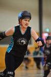 Phoebe Hart playing roller derby