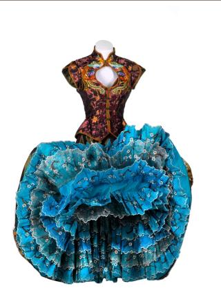 Costume on a mannequin featuring a bodice with an ornate asian-influenced design and a full skirt that has been turned up to show the layers of lace petticoats under the main fabric. The costume was worn by a dancer in the film Moulin Rouge!