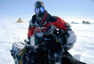 Cinematographer Wade Fairley on a snow mobile wearing polar gear