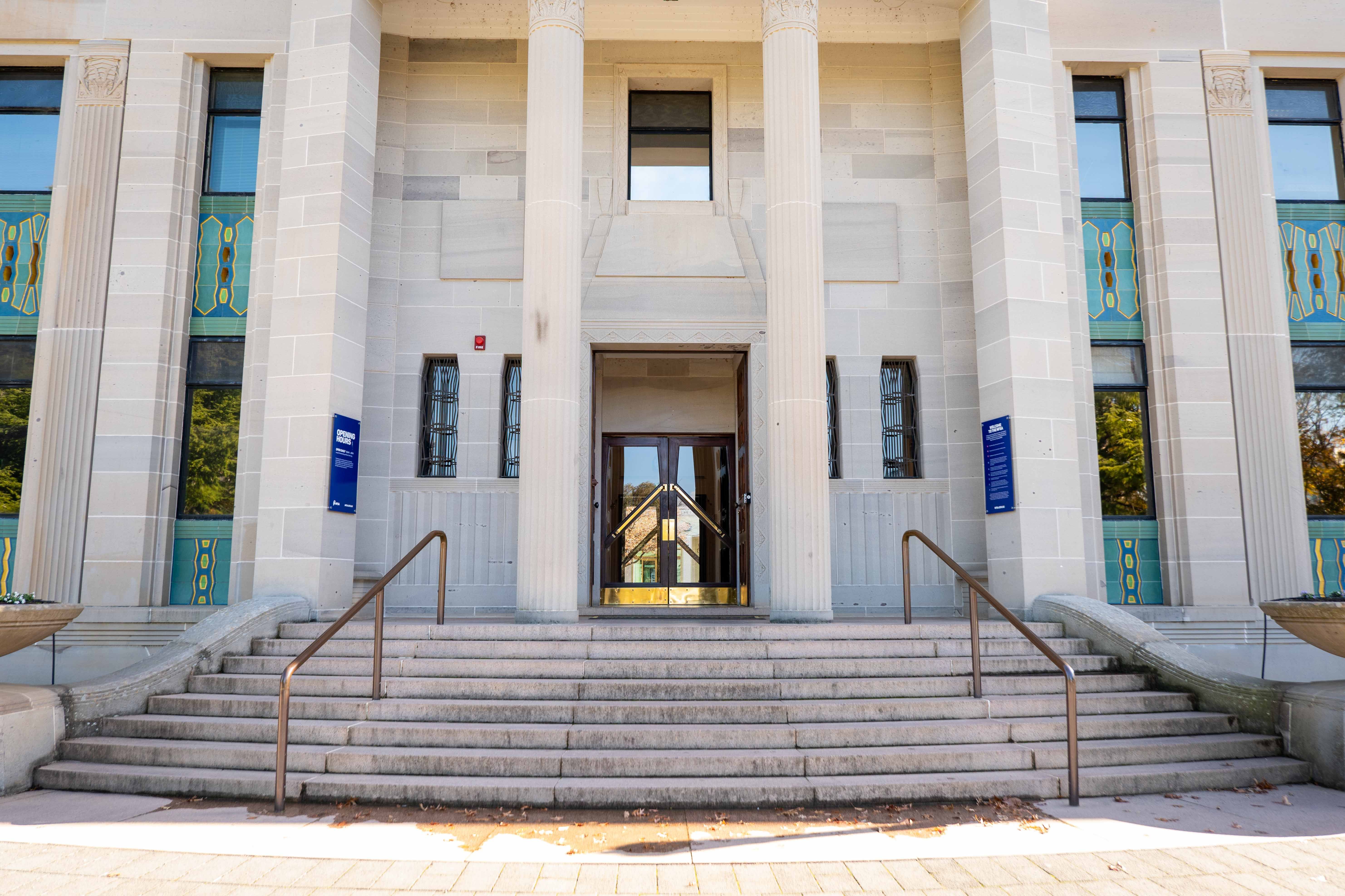 NFSA Acton heritage building entrance closeup showing stairs, rails and front door.