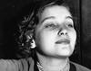 A young Lillian Roxon looks off into the distance.