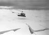 Photo of a helicopter landing on an ice flow