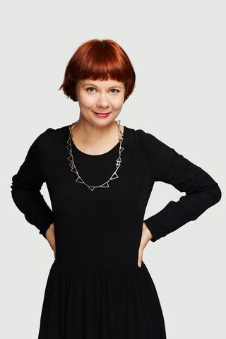 NFSA Chief Curator Meagan Loader wearing a black outfit and standing with her hands on her hips.