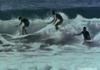 Three people surfing