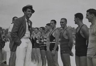Charles Farrell and a line up of surf lifesavers