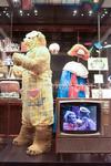 Fredd Bear costume on display in a glass case at the NFSA. A clip of Fredd Bear plays on a TV in front of the case