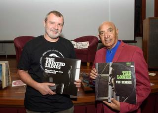 NFSA Curator Thorsten Kaeding and singer-songwriter Vic Simms both holding vinyl versions of Vic's album The Loner