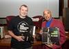 NFSA Curator Thorsten Kaeding and singer-songwriter Vic Simms both holding vinyl versions of Vic's album The Loner
