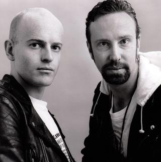 Head and shoulders shot of two young men (Simon Hunt and Stephen Cummins) side by side looking directly at camera