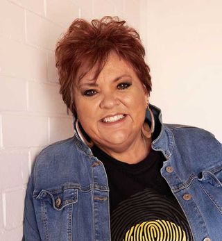 First Nations Engagement Committee member Jodie Bell smiling at the camera.