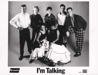 Seven members of the band I'm Talking posing for a publicity image.