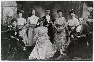 The Corrick family with their musical instruments posing for the camera