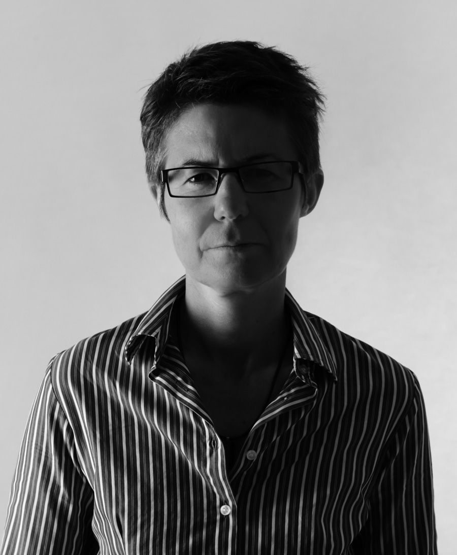 Head and shoulders black and white photo of filmmaker Julie Kalceff looking directly at camera.