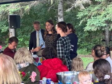 A group of attendees sing a round