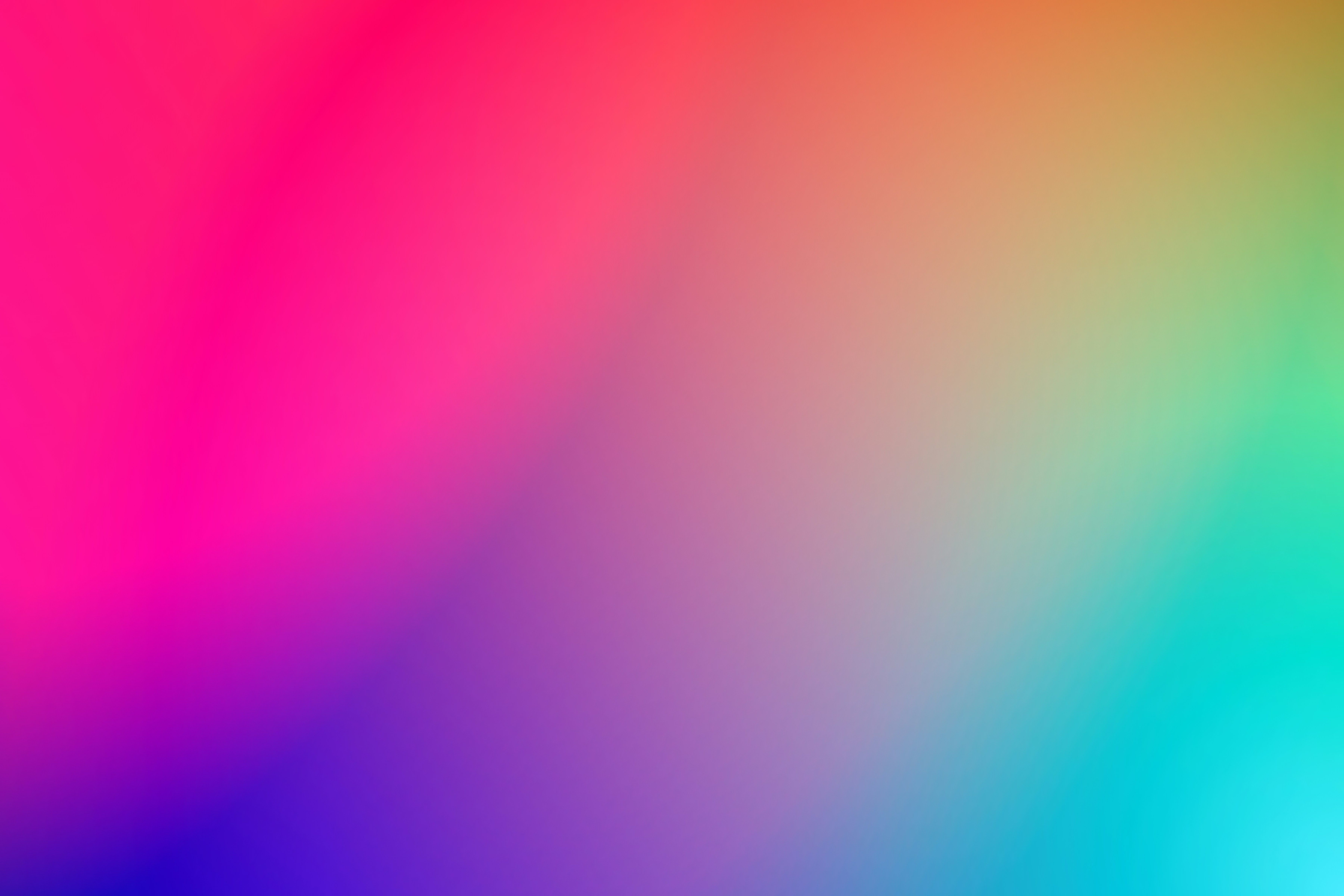 a colorful blurred background with a rainbow of colors .