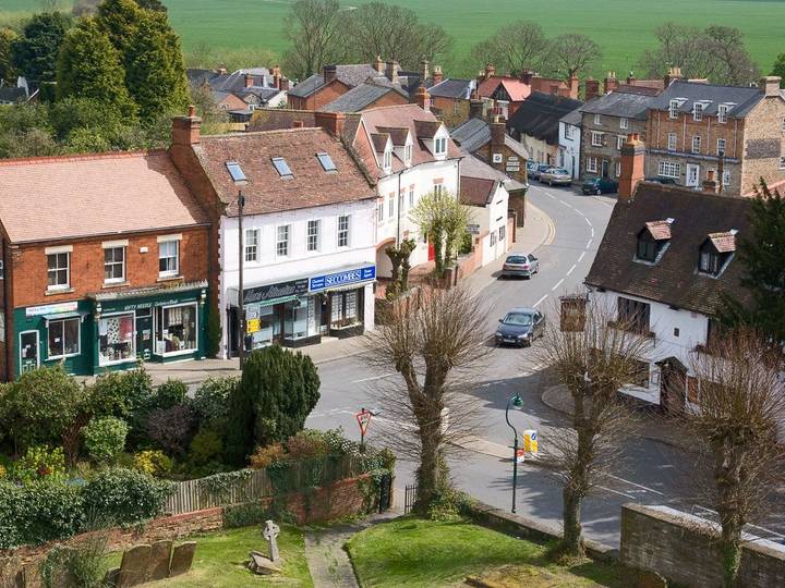 Looking out over the heart of Kineton from the historic St. Peter's Church, showing the layout of the village streets and local architecture.