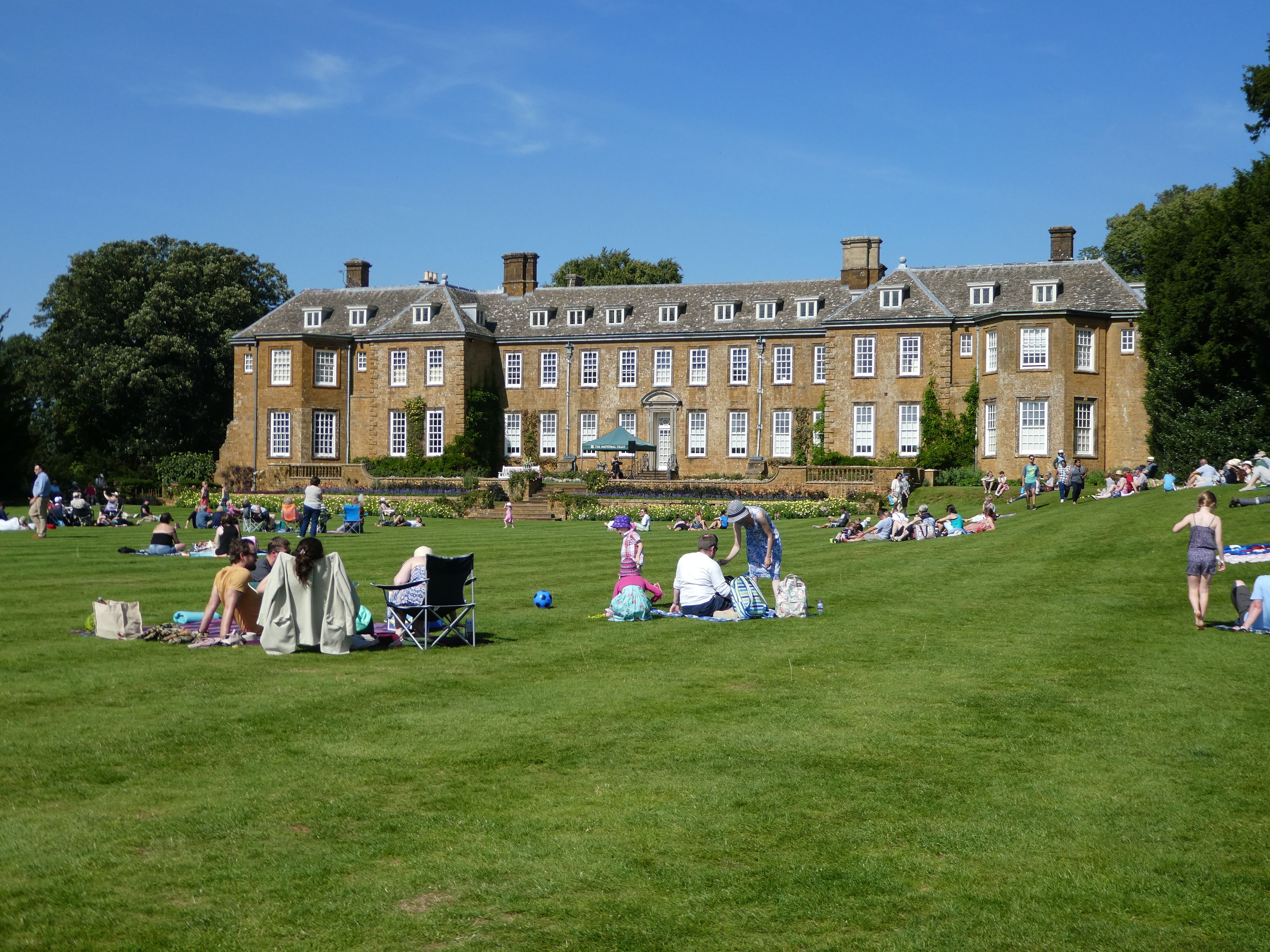 People enjoying the sun at Upton House
