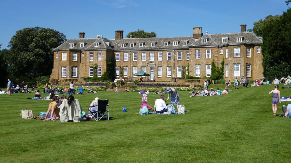 People enjoying the sun at Upton House