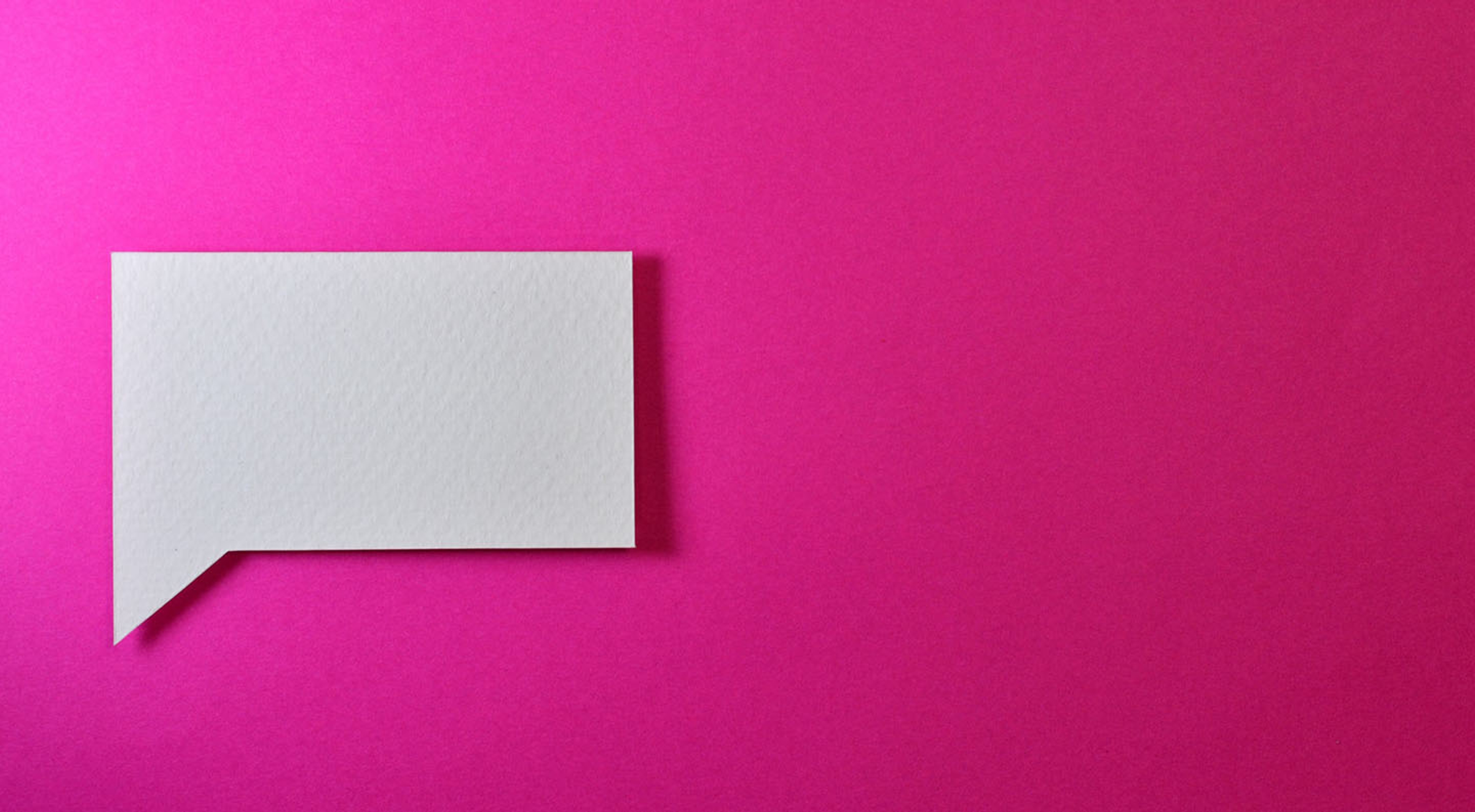 Decentraland white paper depicted as a white cardboard speech bubble on a pink background