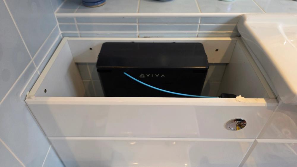 New black concealed cistern fitted inside the boxed-in unit behind a toilet