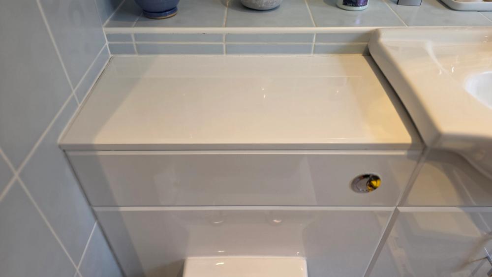 Boxed-in toilet unit closed up again after the new cistern was fitted