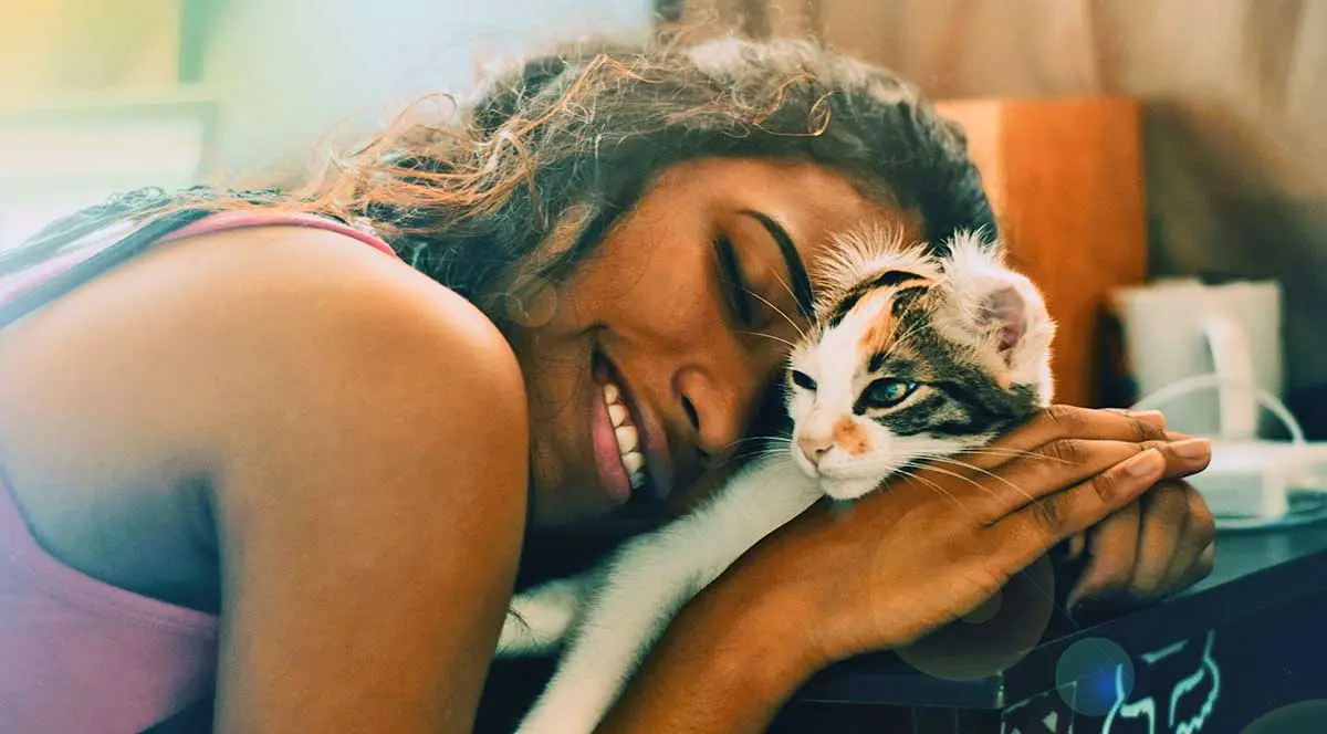 woman smiling with cat