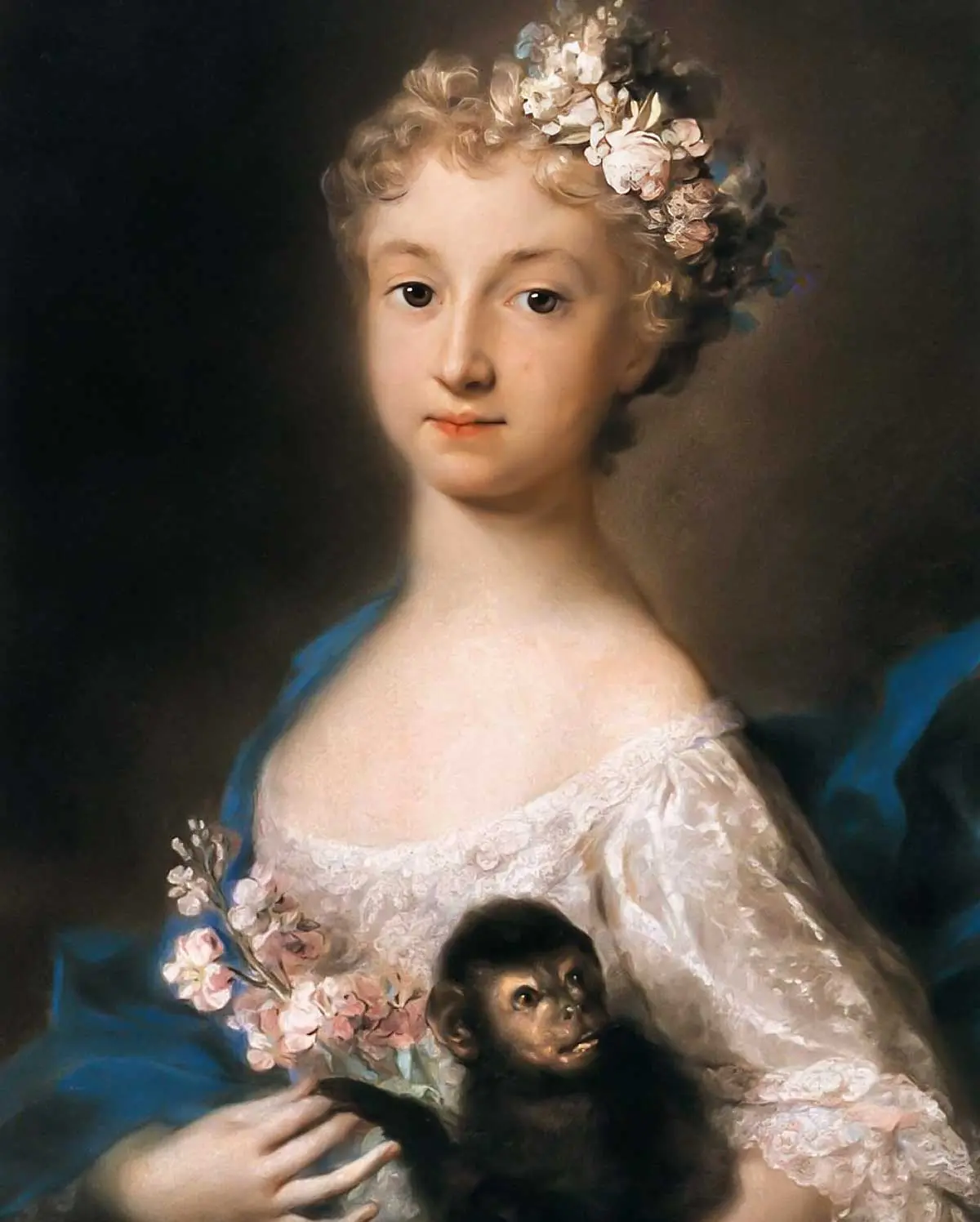 young girl holding a monkey