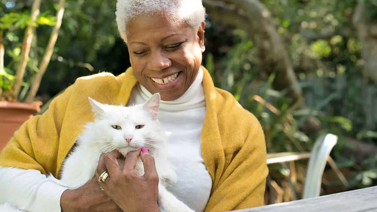 older woman and cat